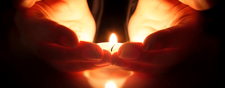 hands-candle-flame