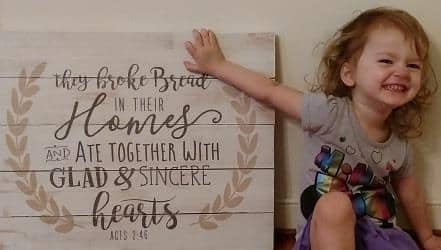 child-break-bread-sign-by-Steven-Cottam