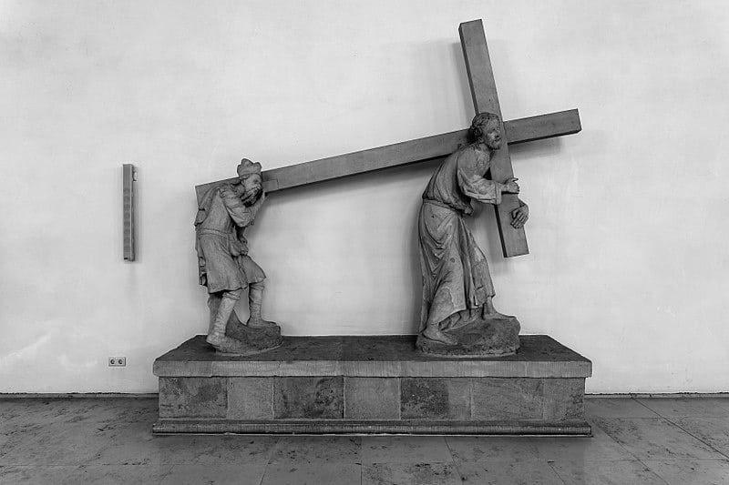 stone-sculpture-two-men-carrying-cross