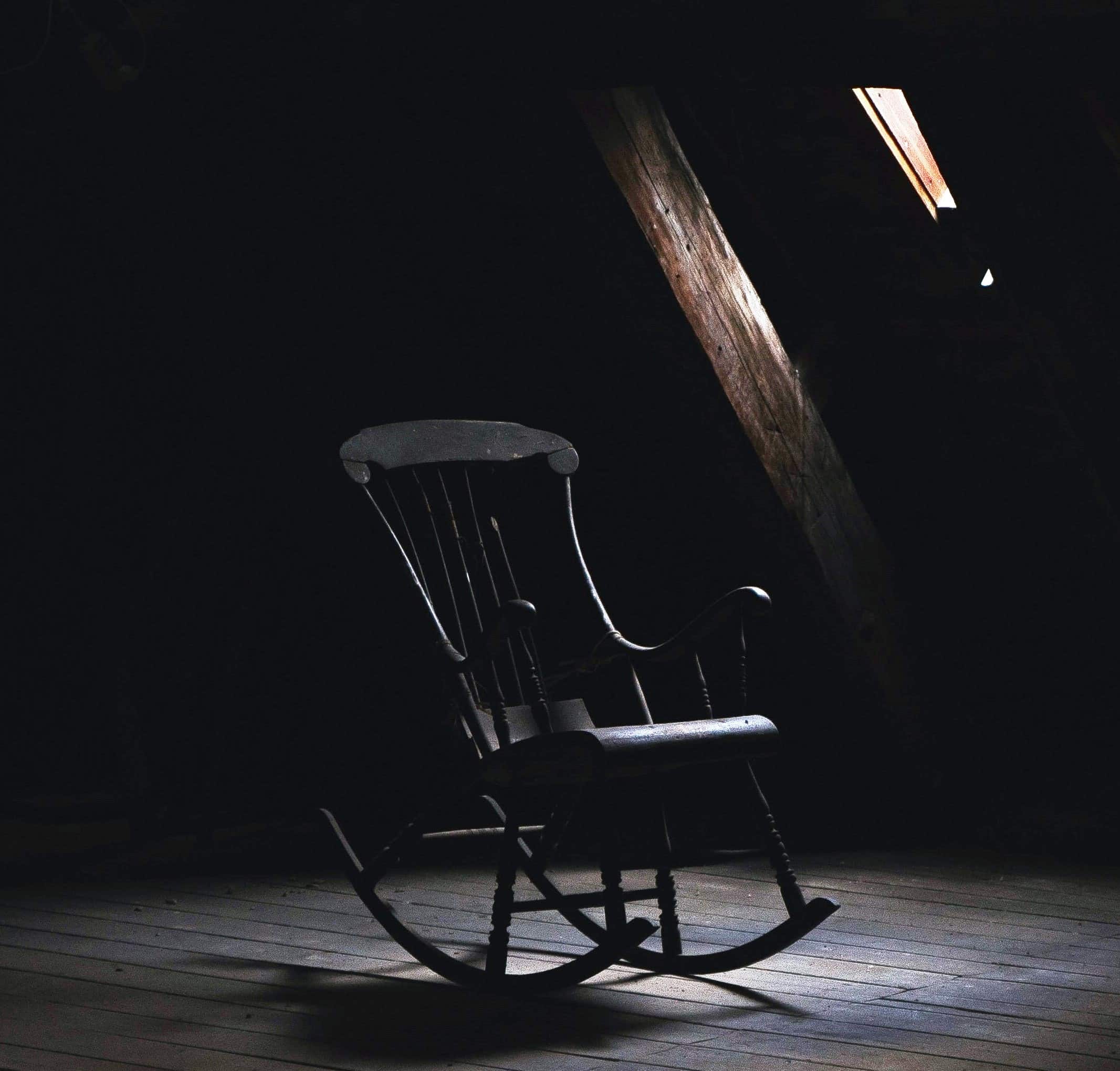 rocking-chair-dark-small-window-light
