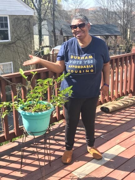 woman-sunglasses-turquoise-pot-small-tree