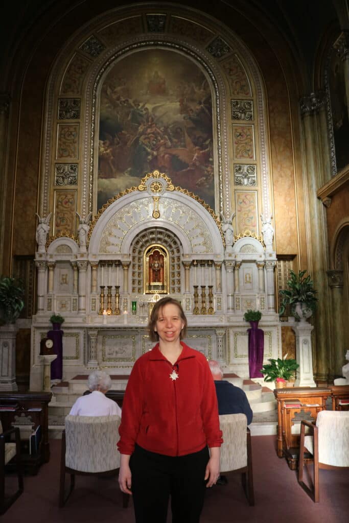 Franciscan Sister of Perpetual Adoration Sarah Hennessey before the monstrance in the St. Rose Convent Adoration Chapel