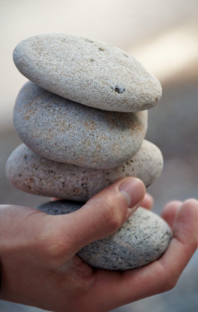 hand-holding-stack-of-four-stones