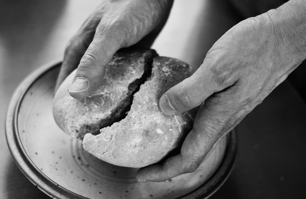 hands-breaking-bread