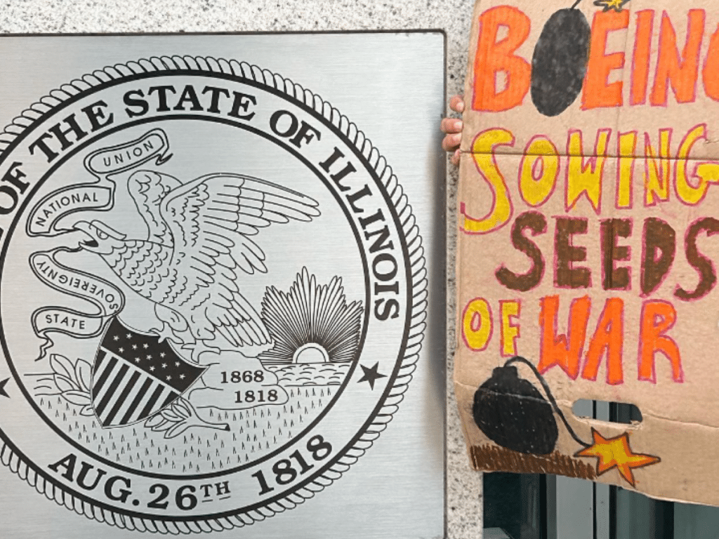 Chicago state seal and Boeing protest sign reading "Boeing sowing seeds of war" and featuring a hand-drawn picture of a bomb