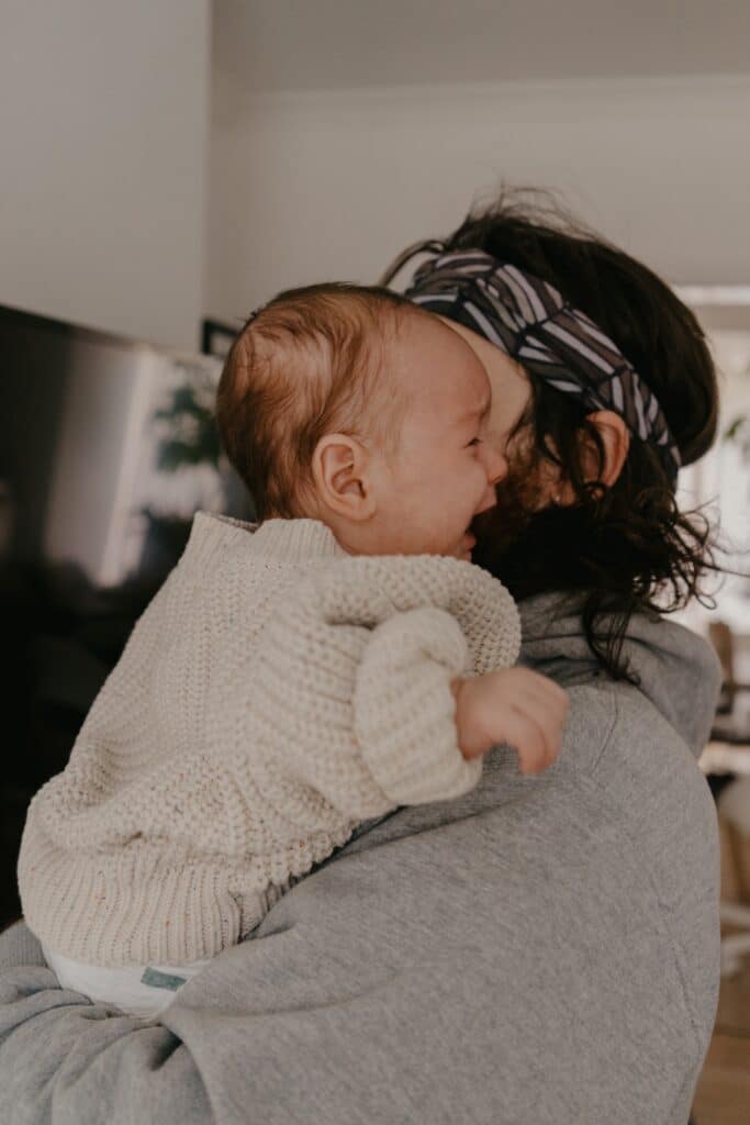 man-headband-holding-baby