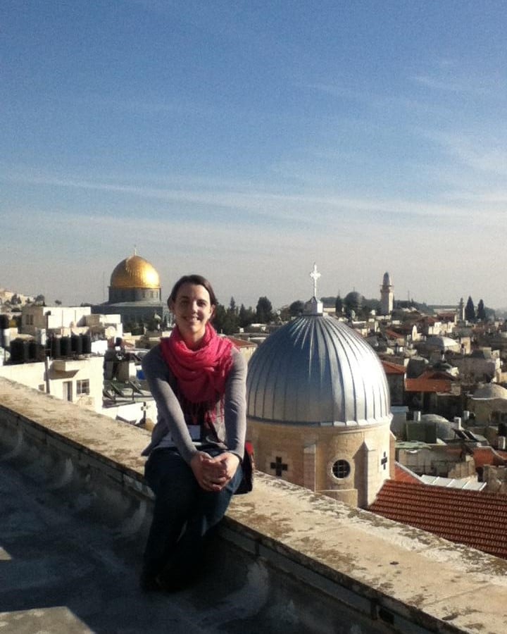 woman-pink-scarf-rooftop-jerusalem-city-scape