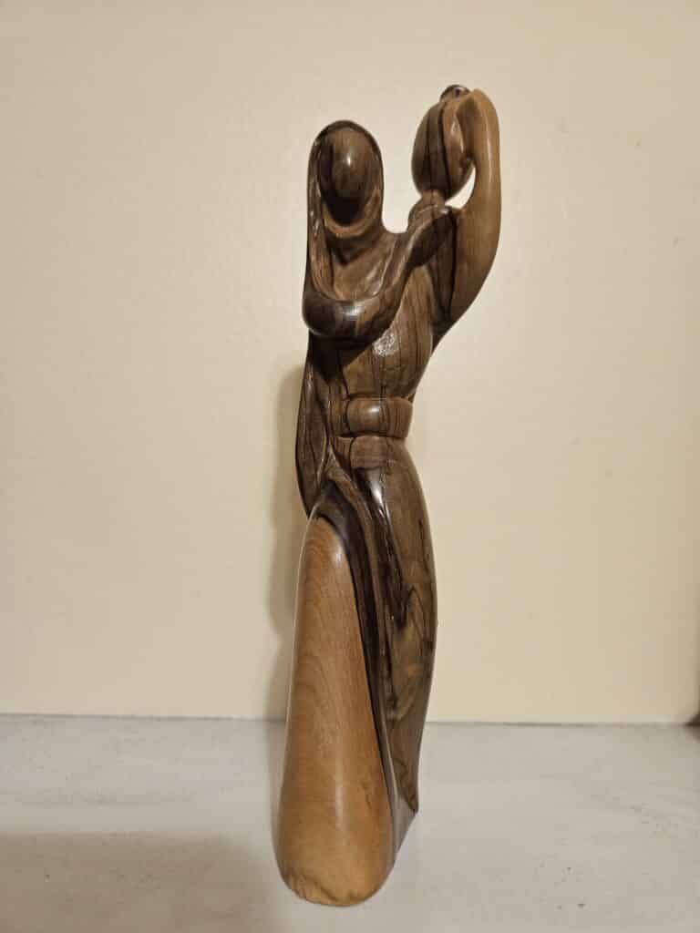 wooden-sculpture-woman-holding-jug