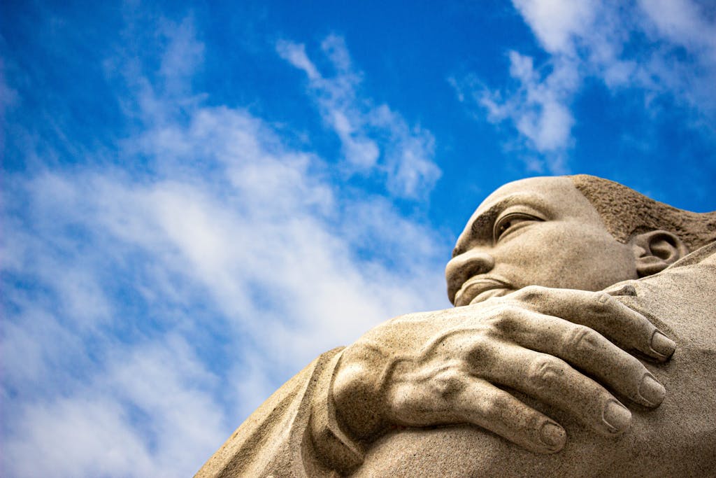 Close-up of the Martin Luther King Jr. Memorial statue against a blue sky in Washington, D.C.