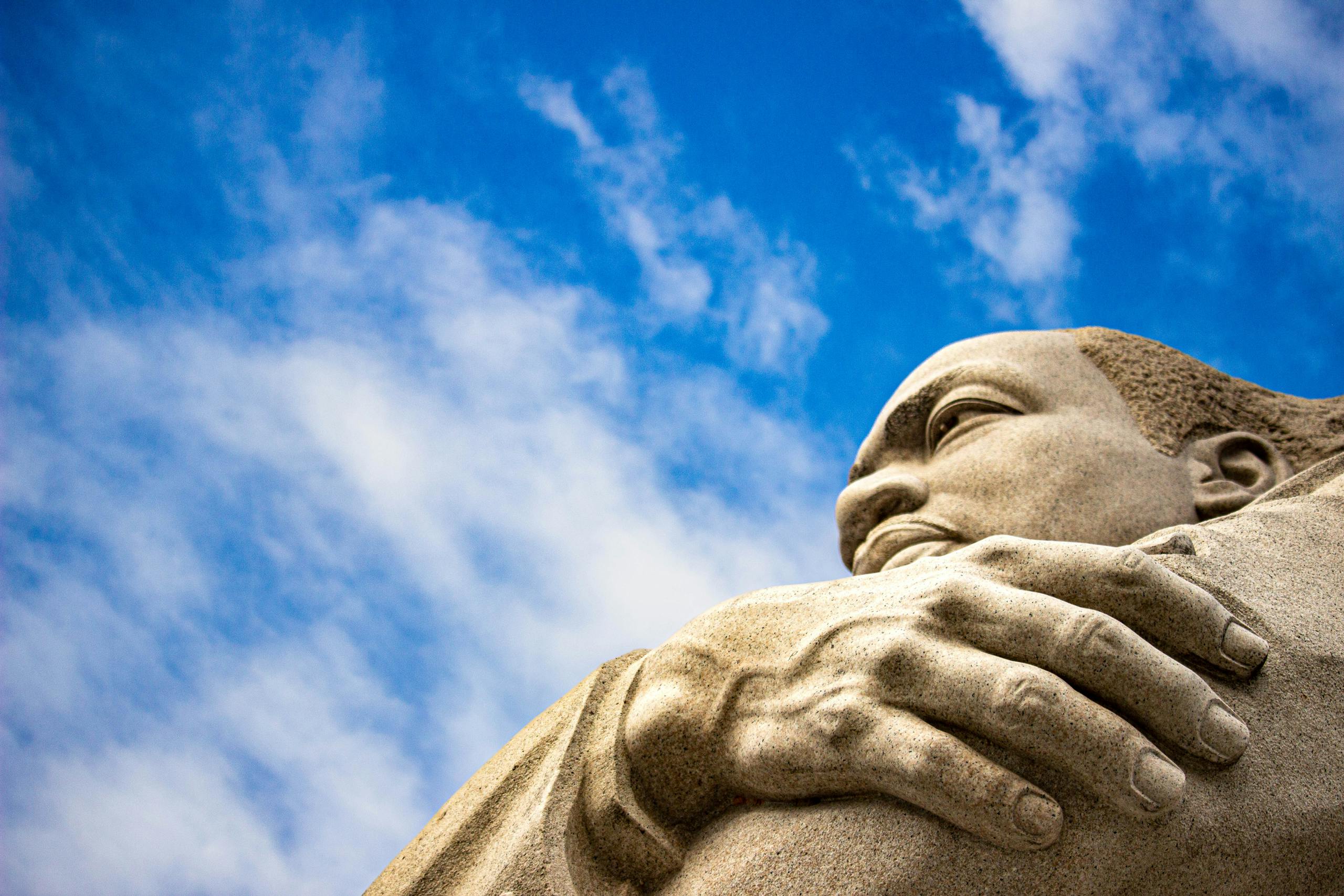 Close-up of the Martin Luther King Jr. Memorial statue against a blue sky in Washington, D.C.