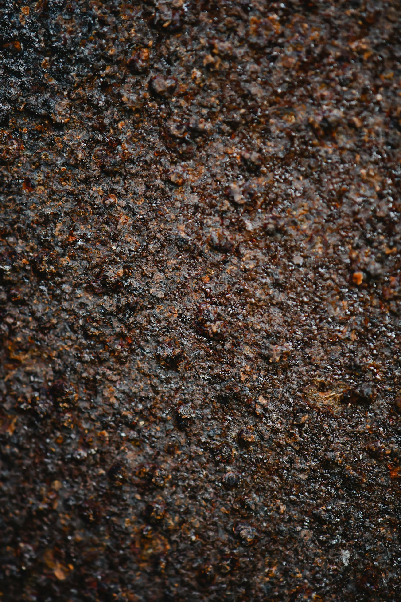 Detailed close-up of a textured and rough rusty surface, ideal for backgrounds.